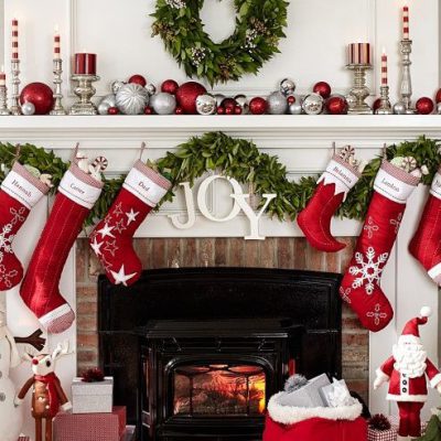 fireplace mantel decorated for holidays