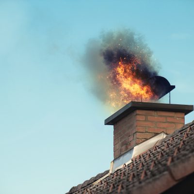 House chimney with some fire coming out it